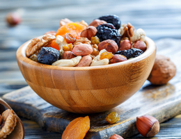 A bowl of nuts and dried fruit.