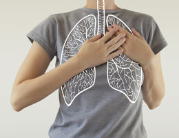 A lung diagram drawn over a photo of a woman in a T-shirt.